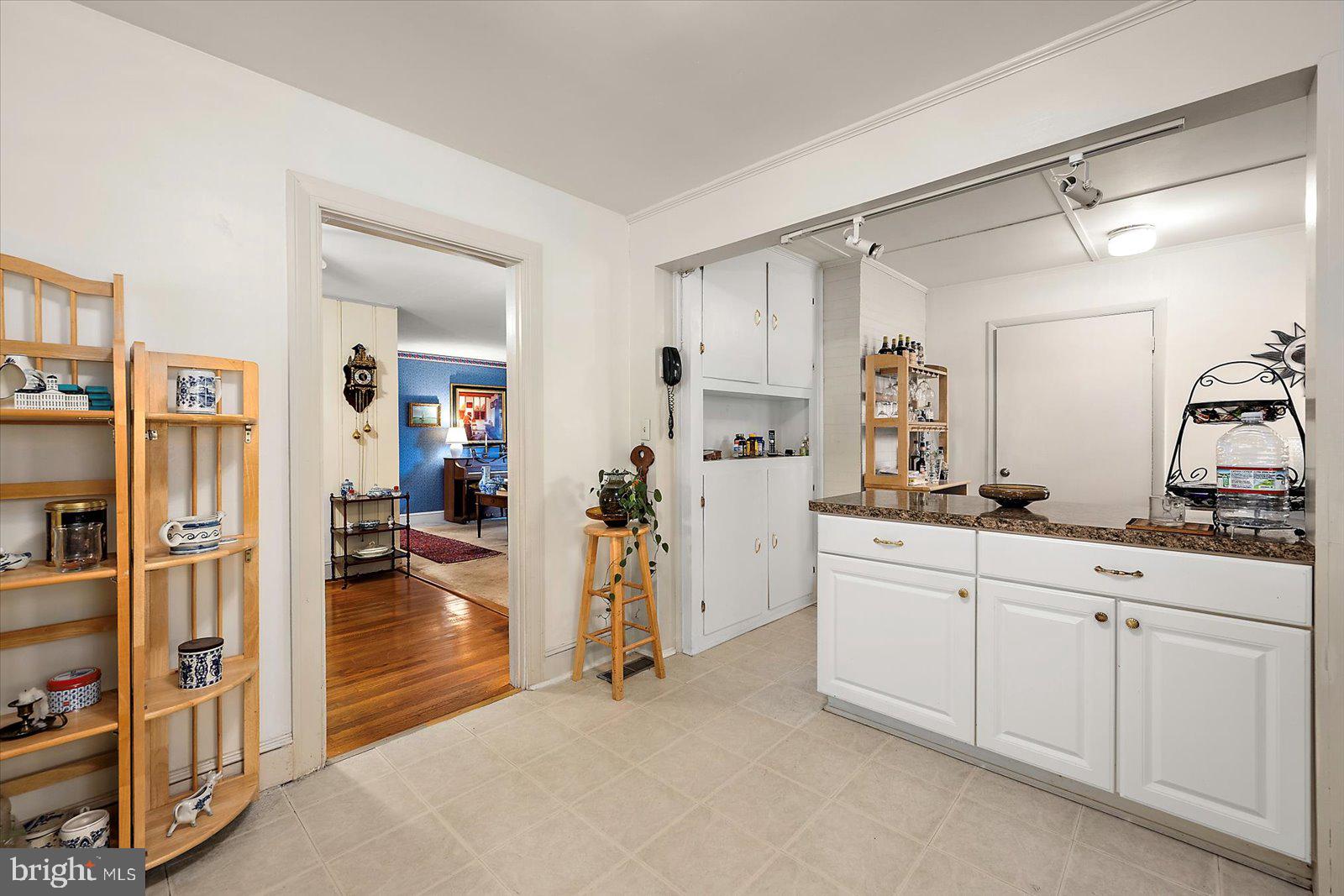 1001 Riverside Drive Salisbury, MD 21801 - Photo 22 of 47 a kitchen with white cabinets and refrigerator