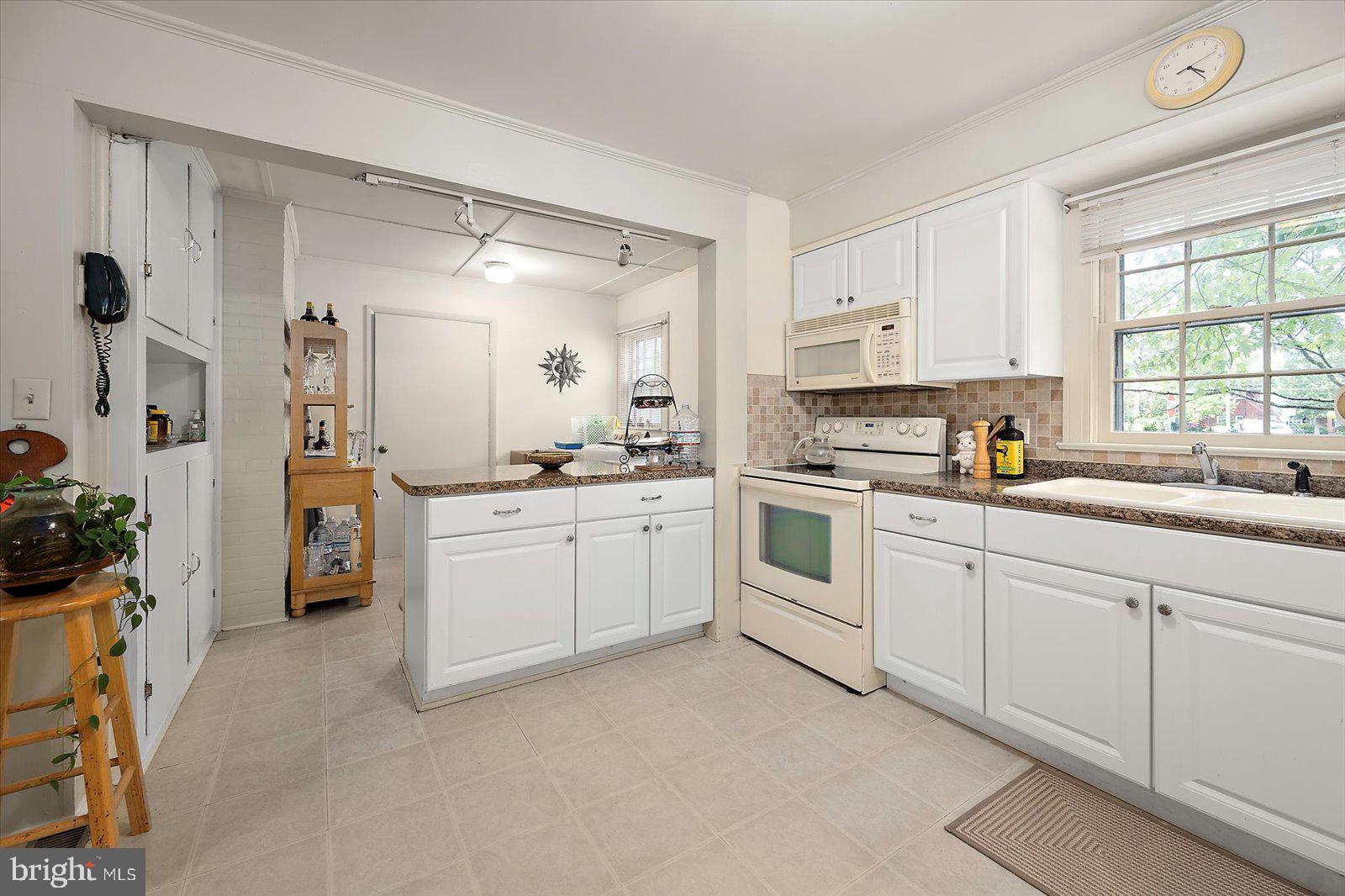 1001 Riverside Drive Salisbury, MD 21801 - Photo 23 of 47 a kitchen with white cabinets and white appliances