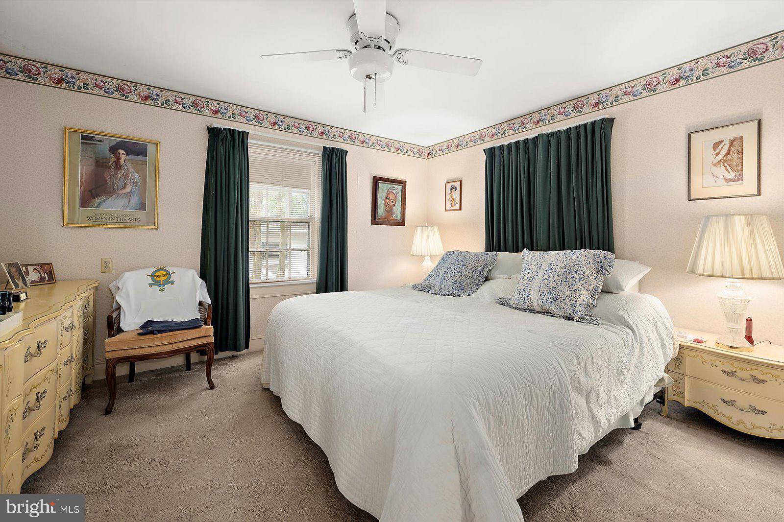 1001 Riverside Drive Salisbury, MD 21801 - Photo 26 of 47 a bedroom with a bed and a chandelier