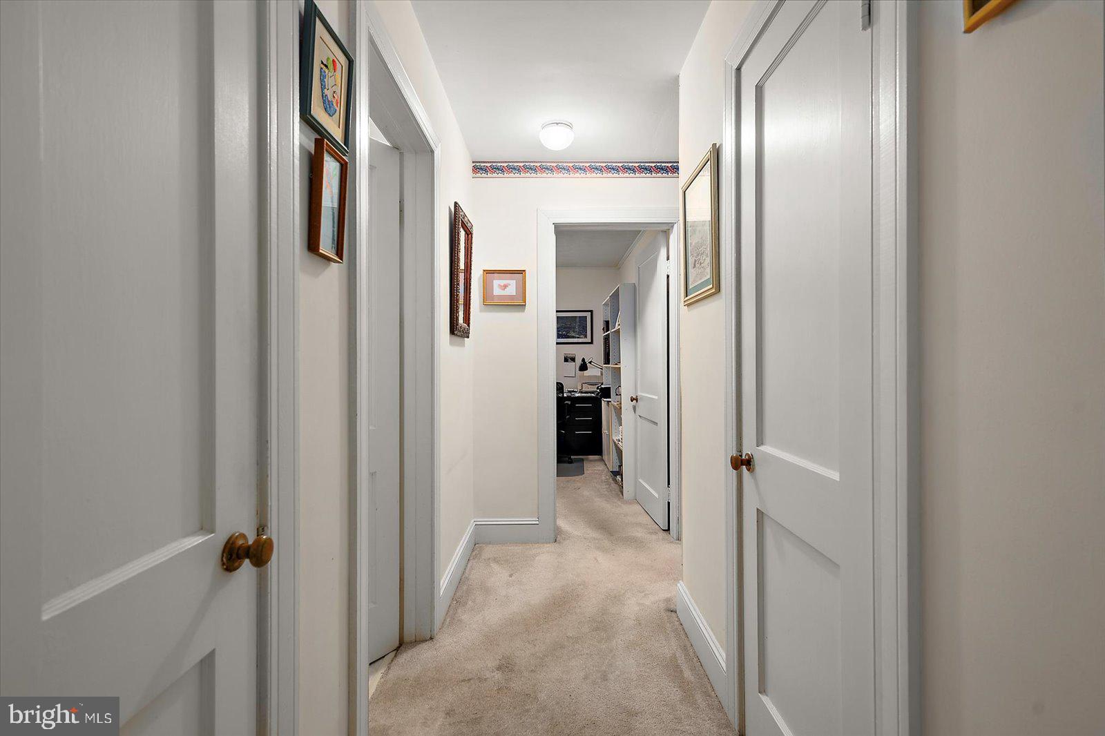 1001 Riverside Drive Salisbury, MD 21801 - Photo 29 of 47 a view of a hallway with wooden shelves