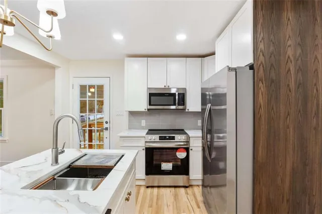 a view of a room that has a table and chairs
