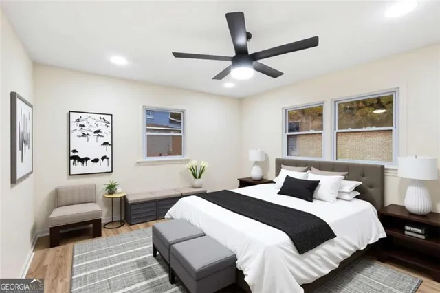 a view of empty room with wooden floor and window