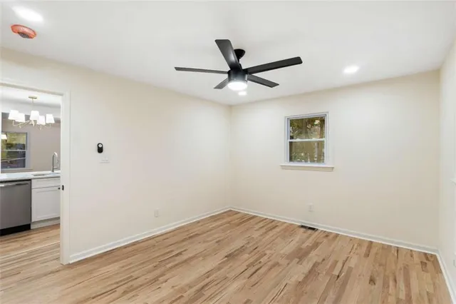 a view of a house with backyard and porch