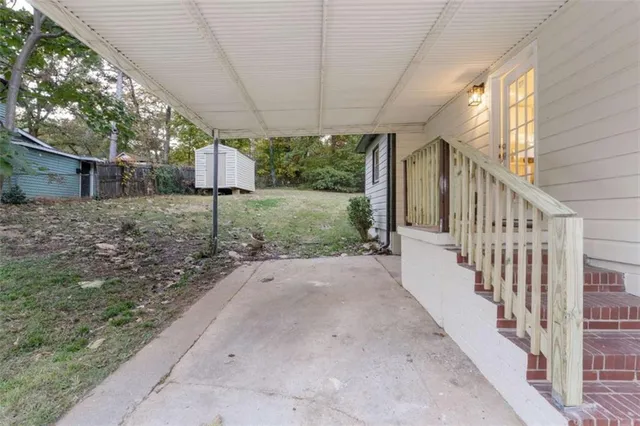 a house that has a tree in front of it