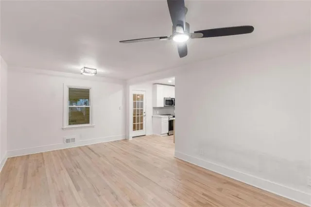 a kitchen with stainless steel appliances granite countertop a sink a refrigerator and a granite counter tops