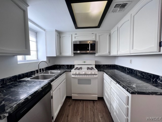 1190 Ramar Road, Unit 46 Bullhead City, AZ 86442 - Photo 14 of 36 a kitchen with granite countertop a sink and a stove top oven