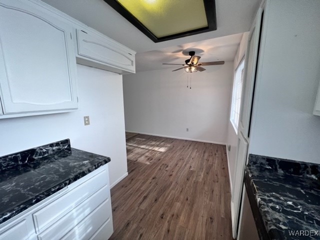 1190 Ramar Road, Unit 46 Bullhead City, AZ 86442 - Photo 16 of 36 a view of a kitchen with wooden floor and a stove top oven