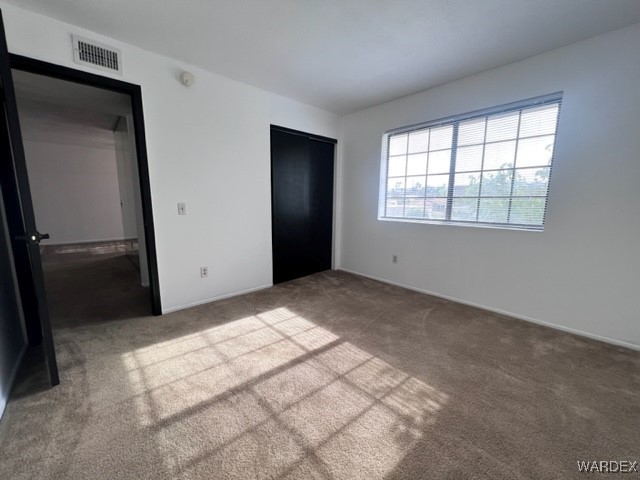 1190 Ramar Road, Unit 46 Bullhead City, AZ 86442 - Photo 20 of 36 an empty room with windows and closet