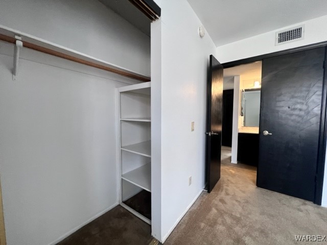 1190 Ramar Road, Unit 46 Bullhead City, AZ 86442 - Photo 25 of 36 a view of a hallway with wooden shelves