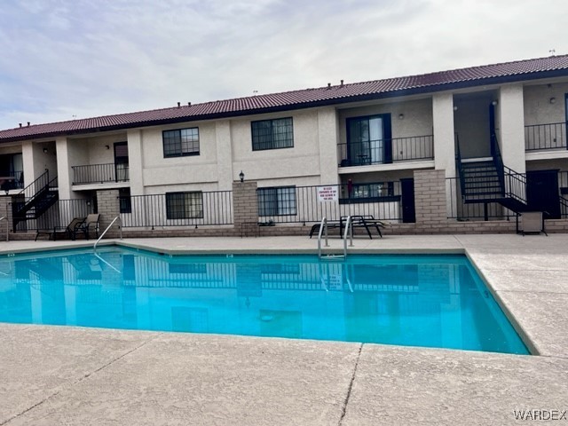 1190 Ramar Road, Unit 46 Bullhead City, AZ 86442 - Photo 3 of 36 a view of a house with swimming pool