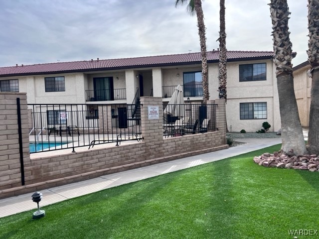 1190 Ramar Road, Unit 46 Bullhead City, AZ 86442 - Photo 32 of 36 a house view with a garden space