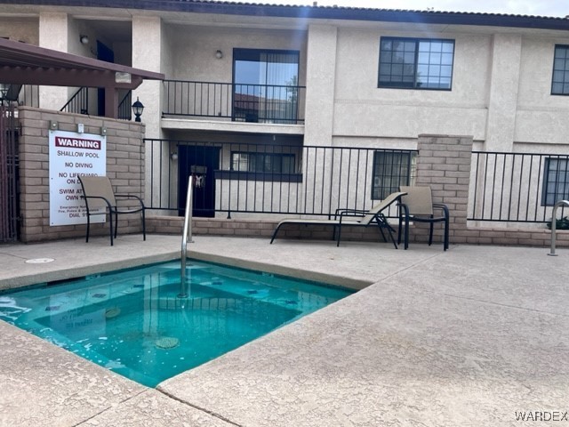 1190 Ramar Road, Unit 46 Bullhead City, AZ 86442 - Photo 33 of 36 a view of a house with swimming pool