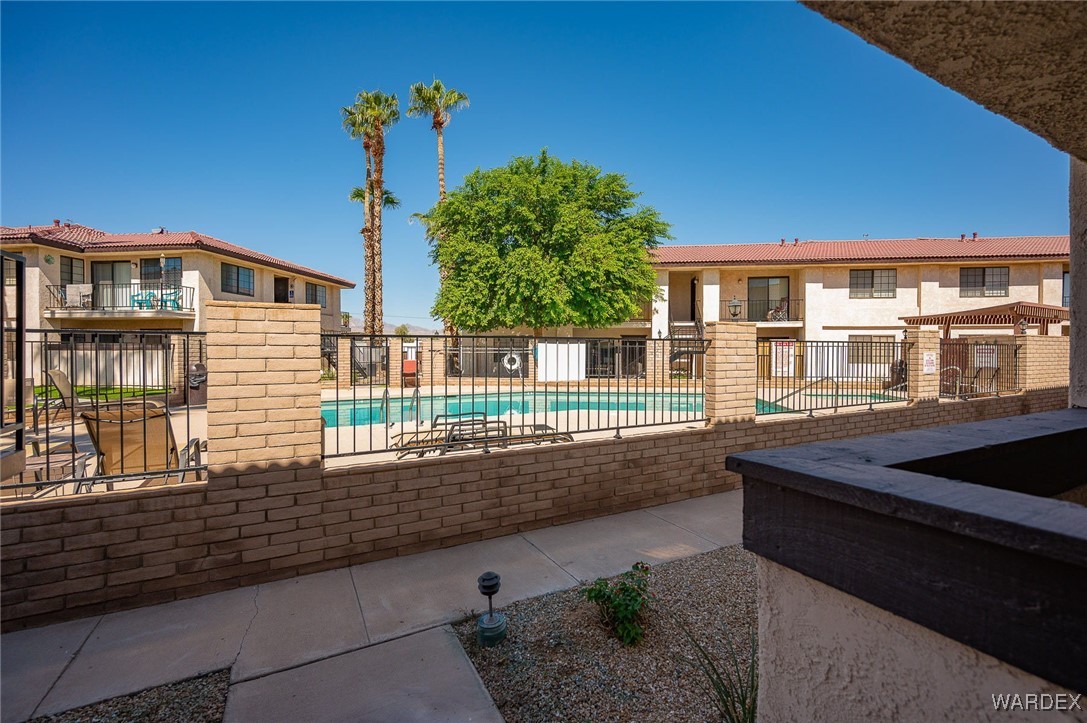 1190 Ramar Road, Unit 46 Bullhead City, AZ 86442 - Photo 34 of 36 a house view with a garden space