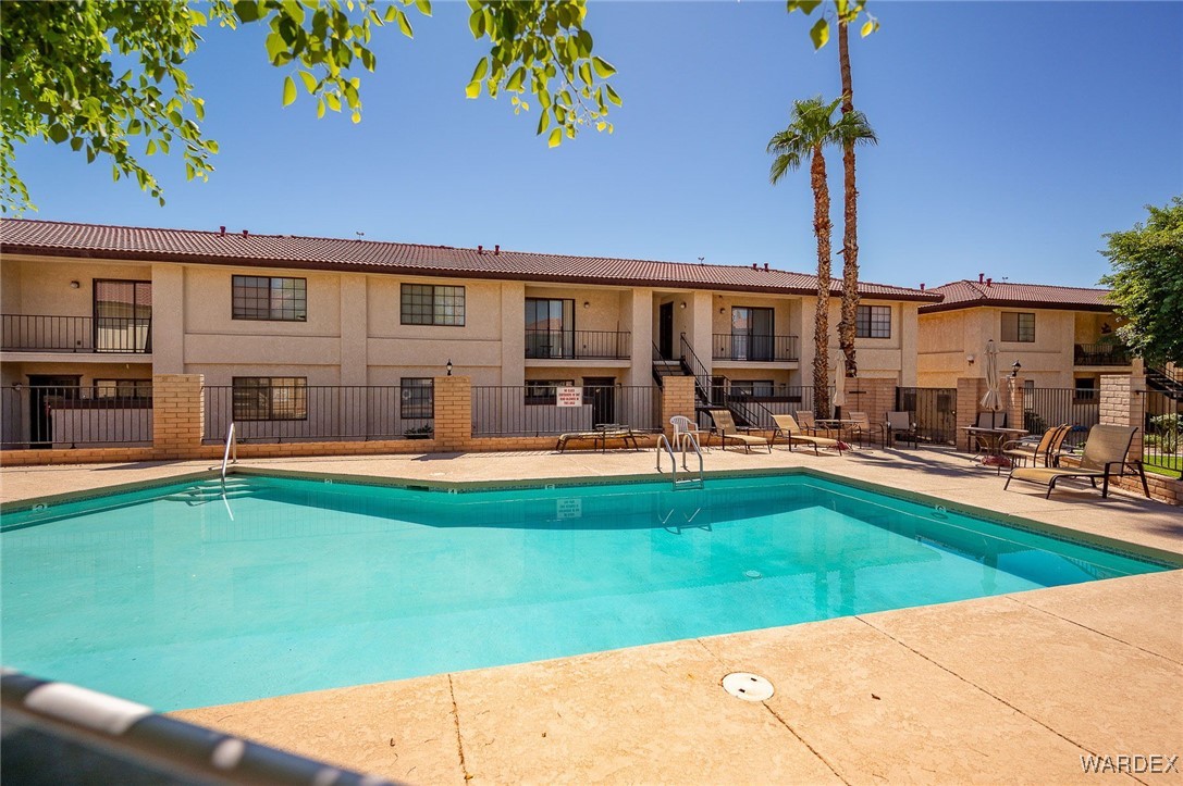 1190 Ramar Road, Unit 46 Bullhead City, AZ 86442 - Photo 35 of 36 a view of a house with swimming pool yard and patio