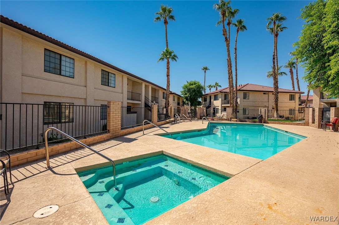 1190 Ramar Road, Unit 46 Bullhead City, AZ 86442 - Photo 4 of 36 a view of a backyard with swimming pool