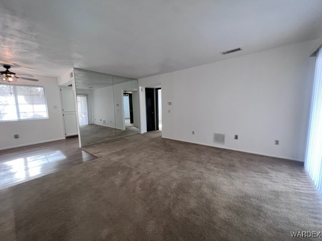 1190 Ramar Road, Unit 46 Bullhead City, AZ 86442 - Photo 7 of 36 a view of a big room with closet and windows