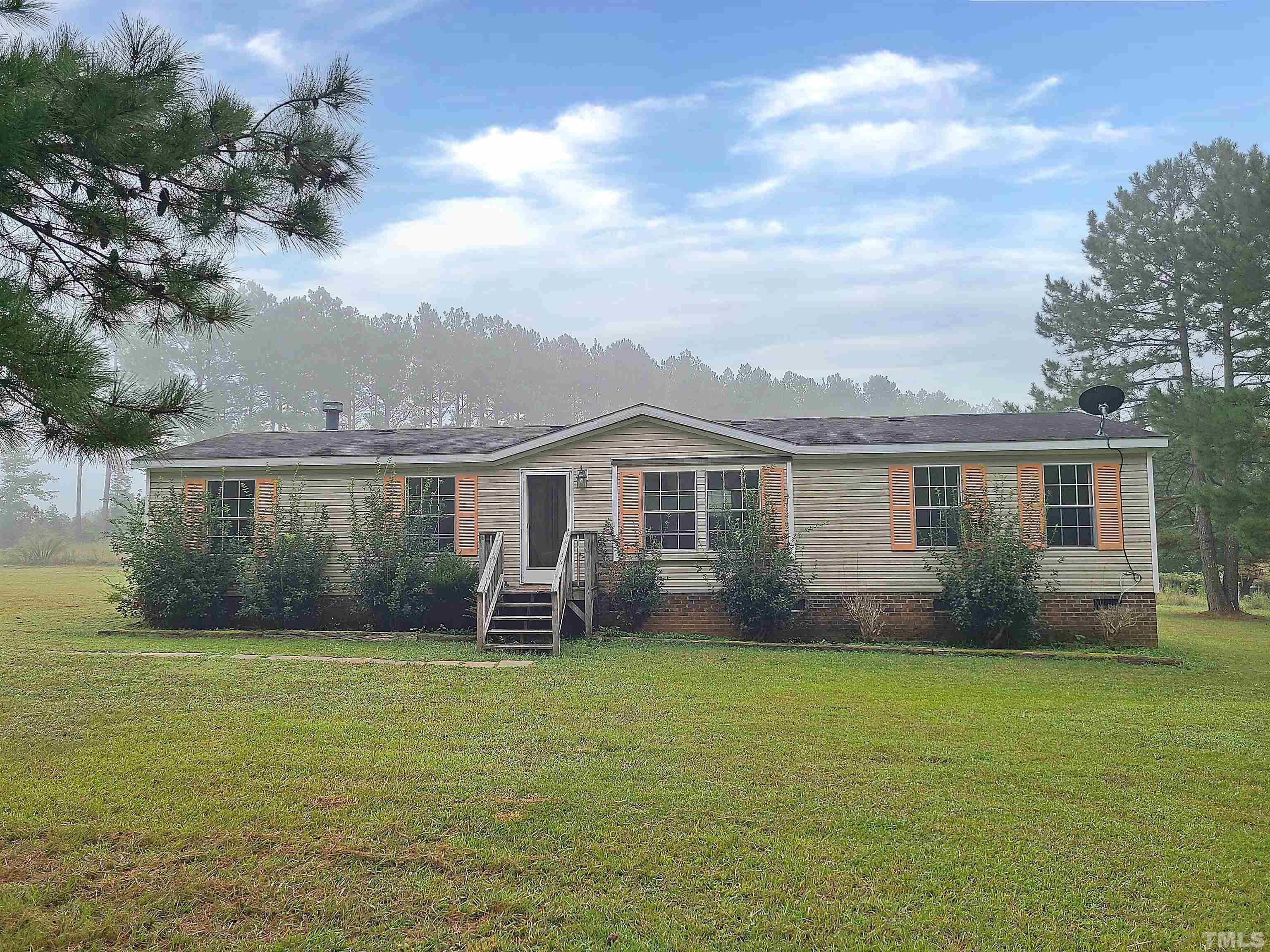 95 Moore Perkerson Road Spring Hope, NC 27882 - Photo 1 of 31 a front view of house with yard and green space