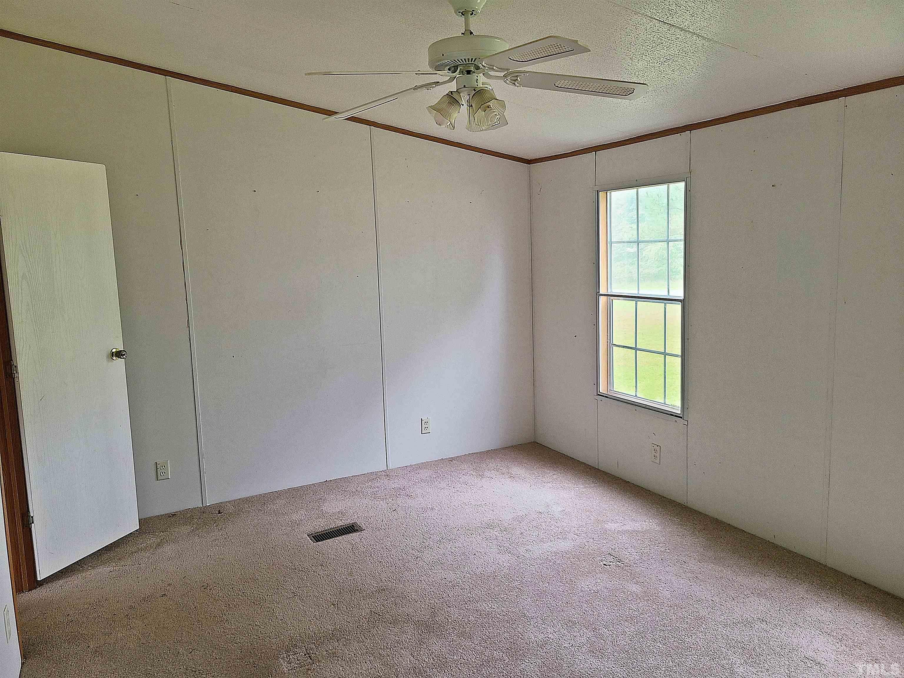 95 Moore Perkerson Road Spring Hope, NC 27882 - Photo 11 of 31 a view of an empty room with a window