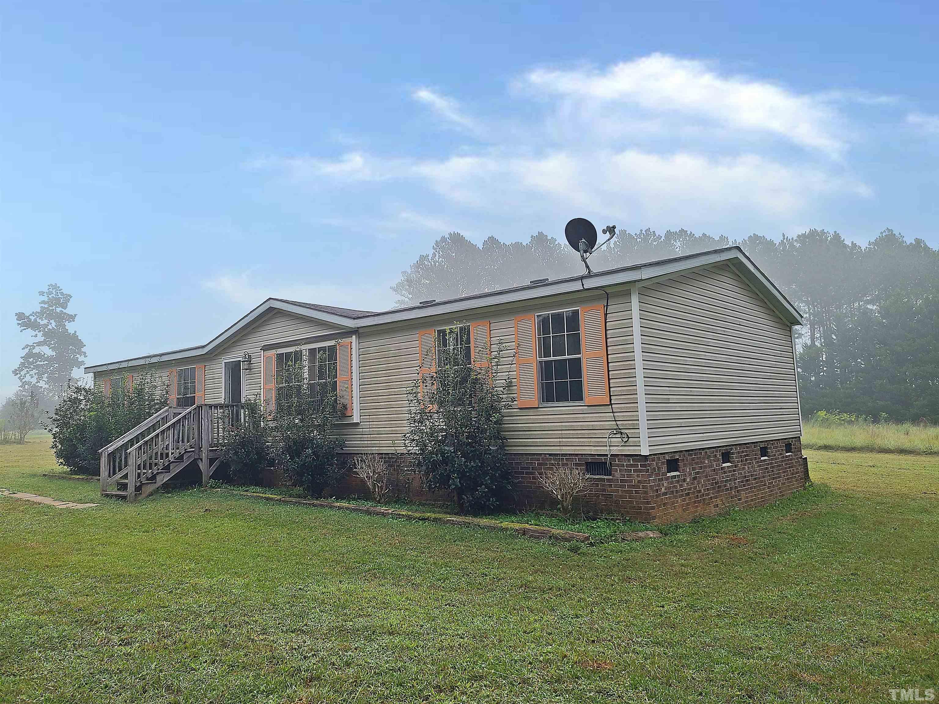 95 Moore Perkerson Road Spring Hope, NC 27882 - Photo 2 of 31 a view of a house with a backyard