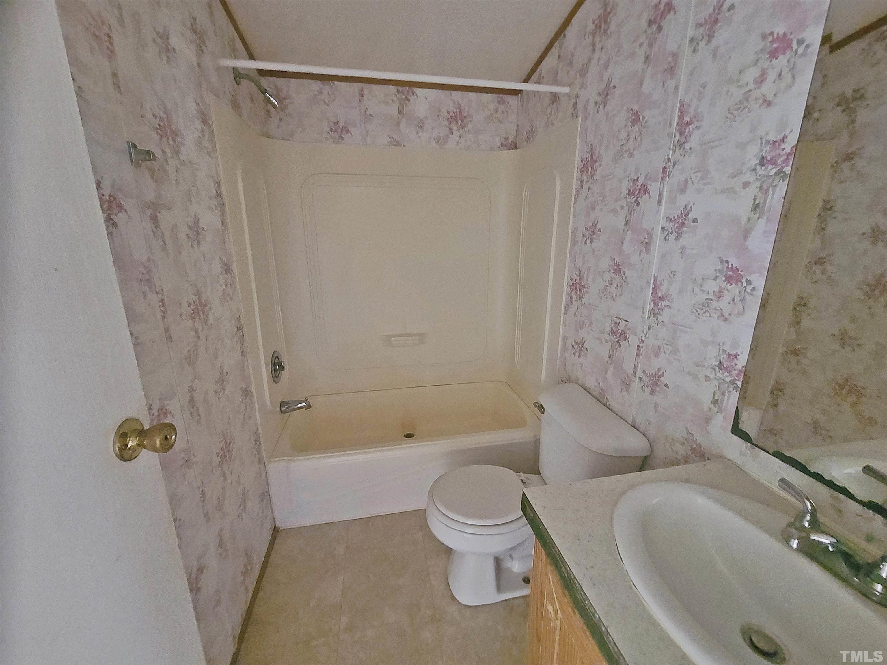 95 Moore Perkerson Road Spring Hope, NC 27882 - Photo 22 of 31 a bathroom with a shower a toilet and a sink