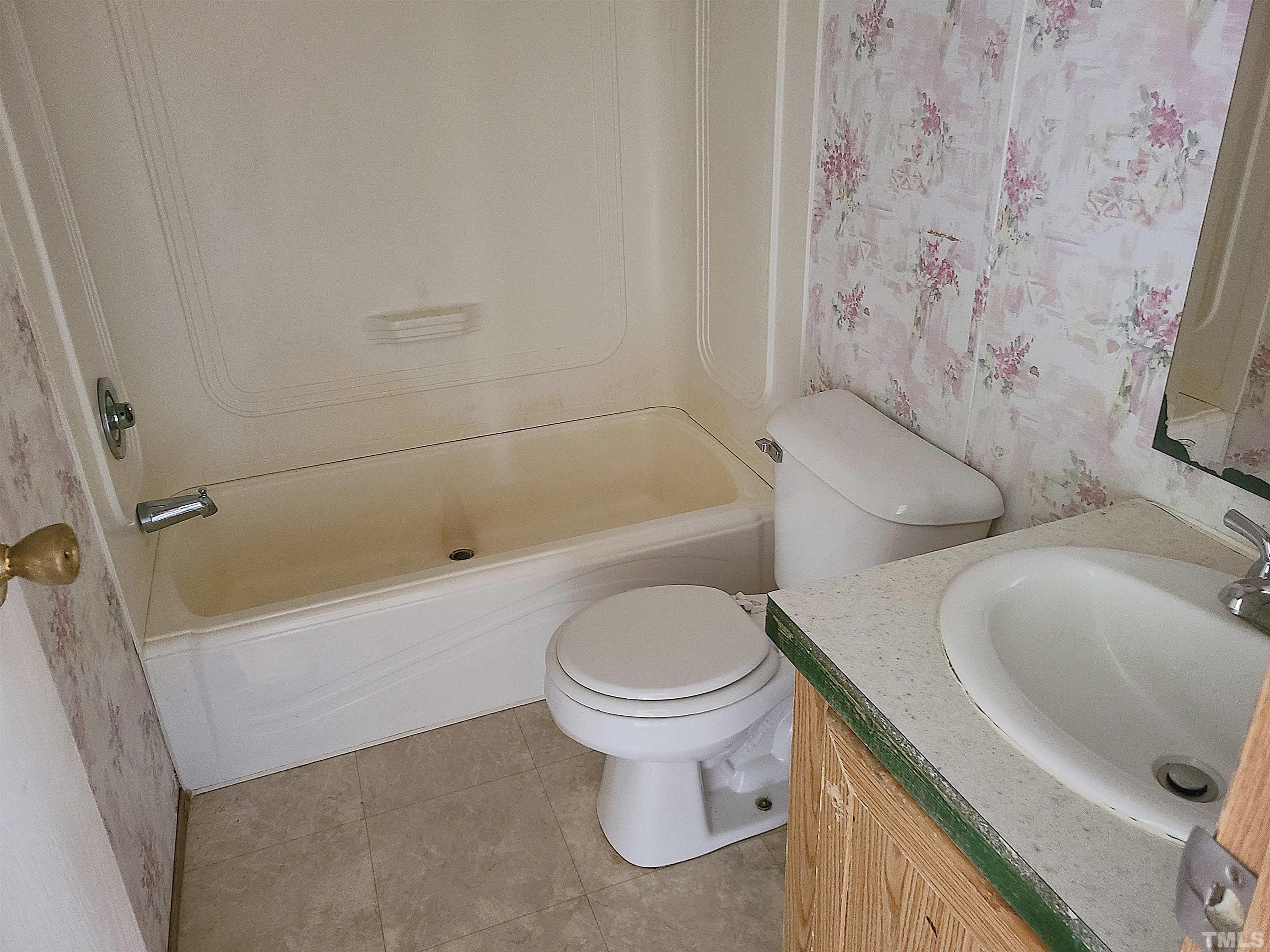 95 Moore Perkerson Road Spring Hope, NC 27882 - Photo 23 of 31 a bathroom with a toilet and a tub