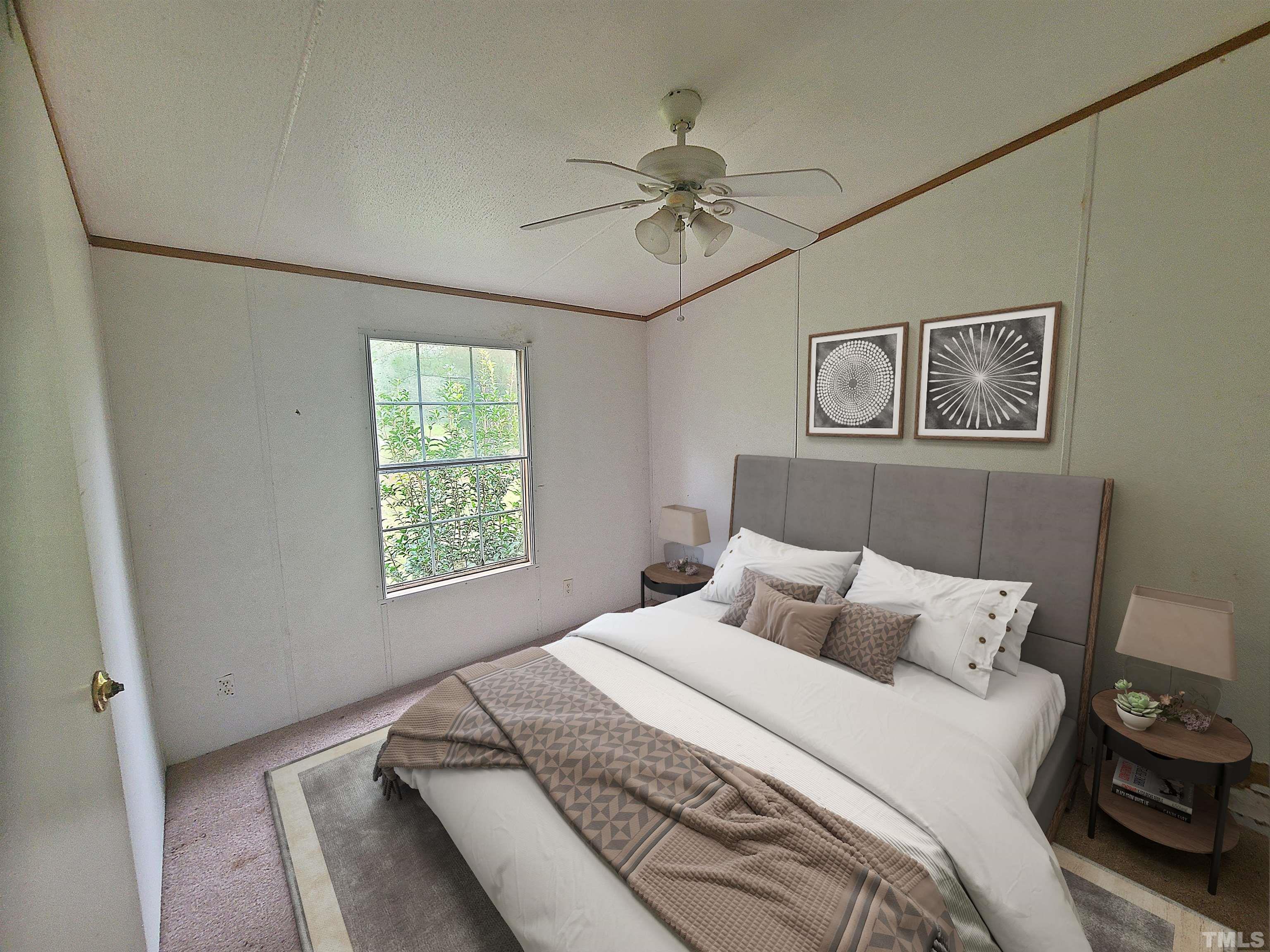 95 Moore Perkerson Road Spring Hope, NC 27882 - Photo 27 of 31 a bedroom with a bed and a chandelier