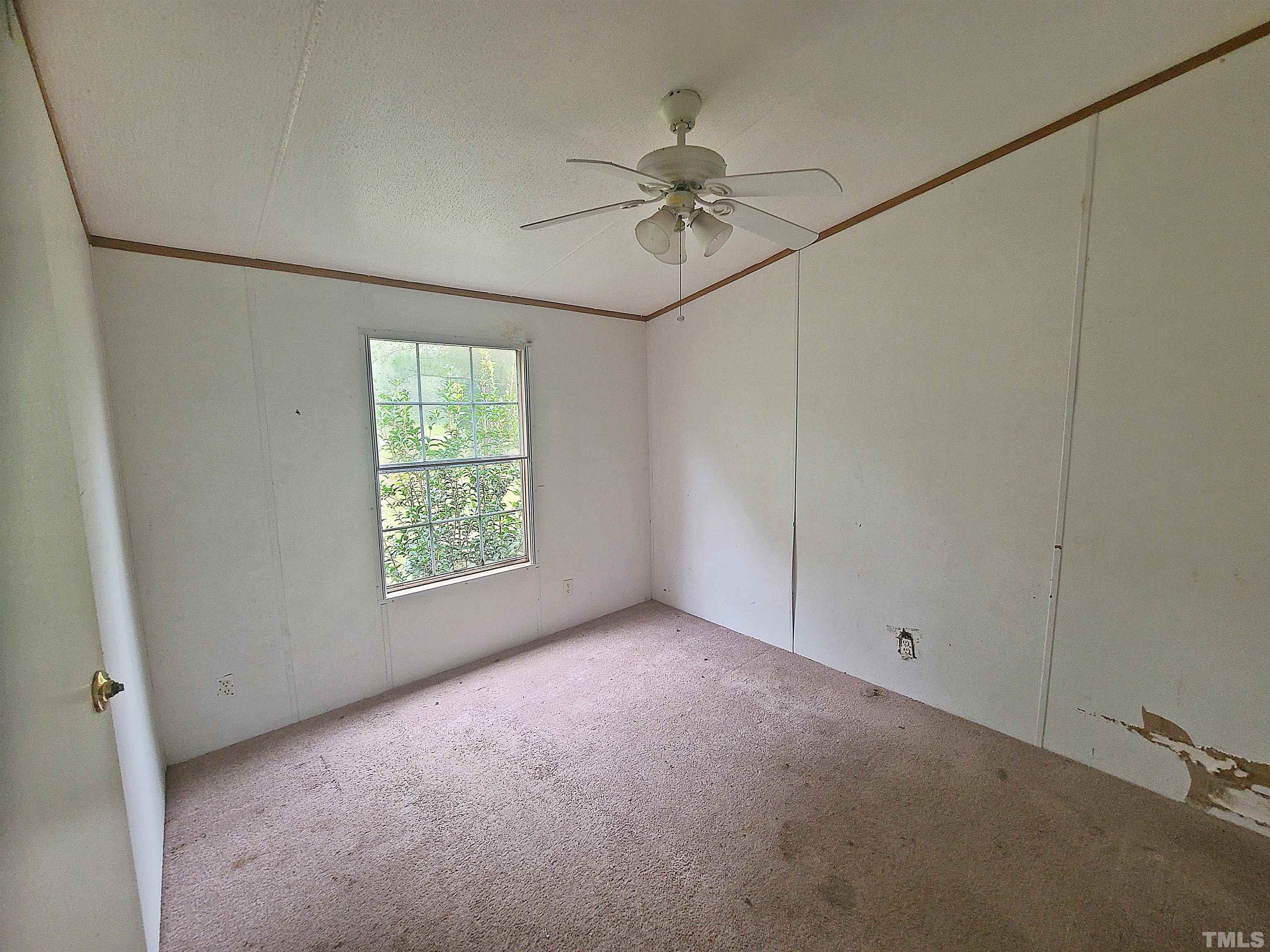 95 Moore Perkerson Road Spring Hope, NC 27882 - Photo 28 of 31 an empty room with windows and fan
