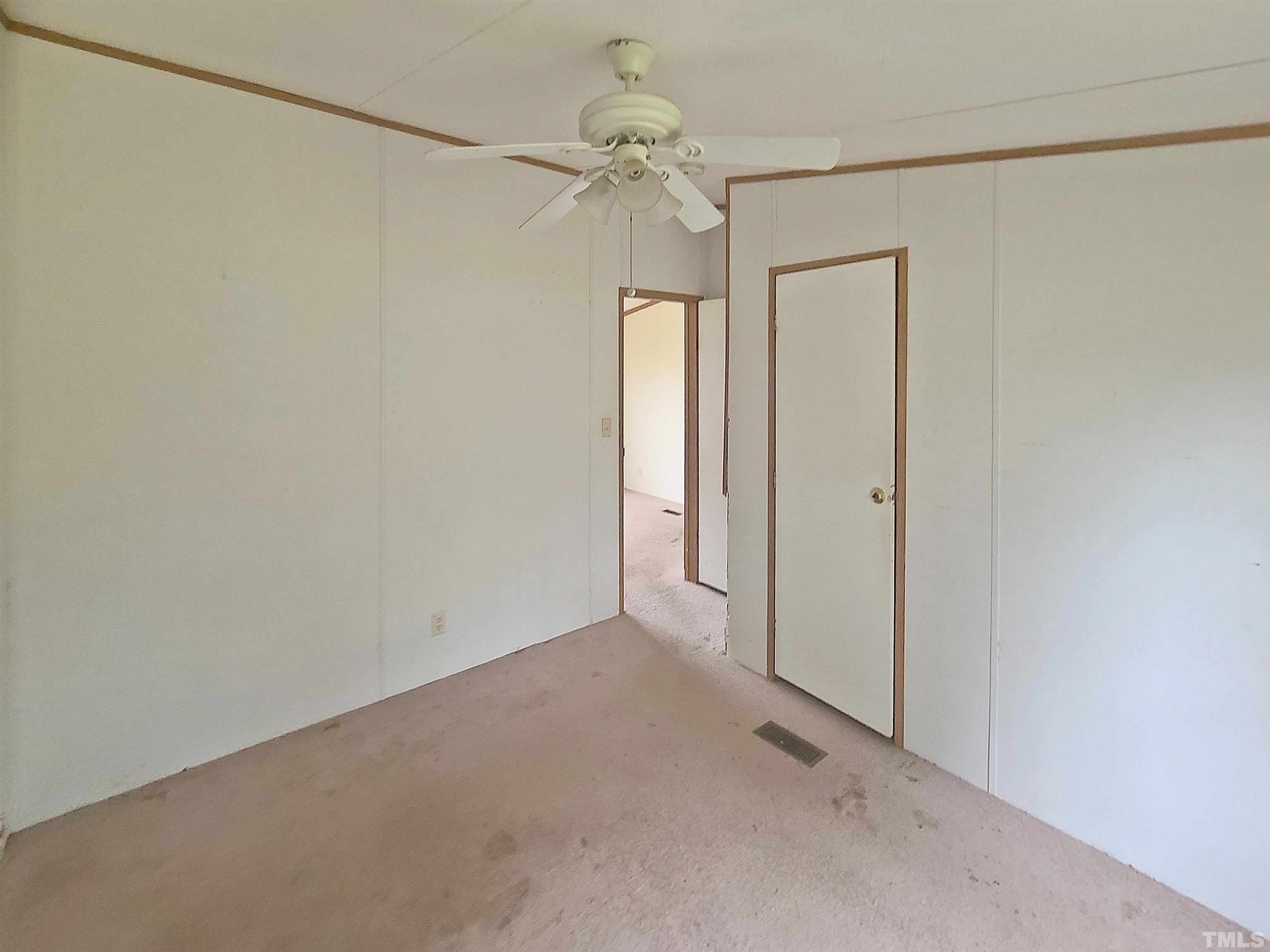 95 Moore Perkerson Road Spring Hope, NC 27882 - Photo 29 of 31 a view of a chandelier fan and closet in a room