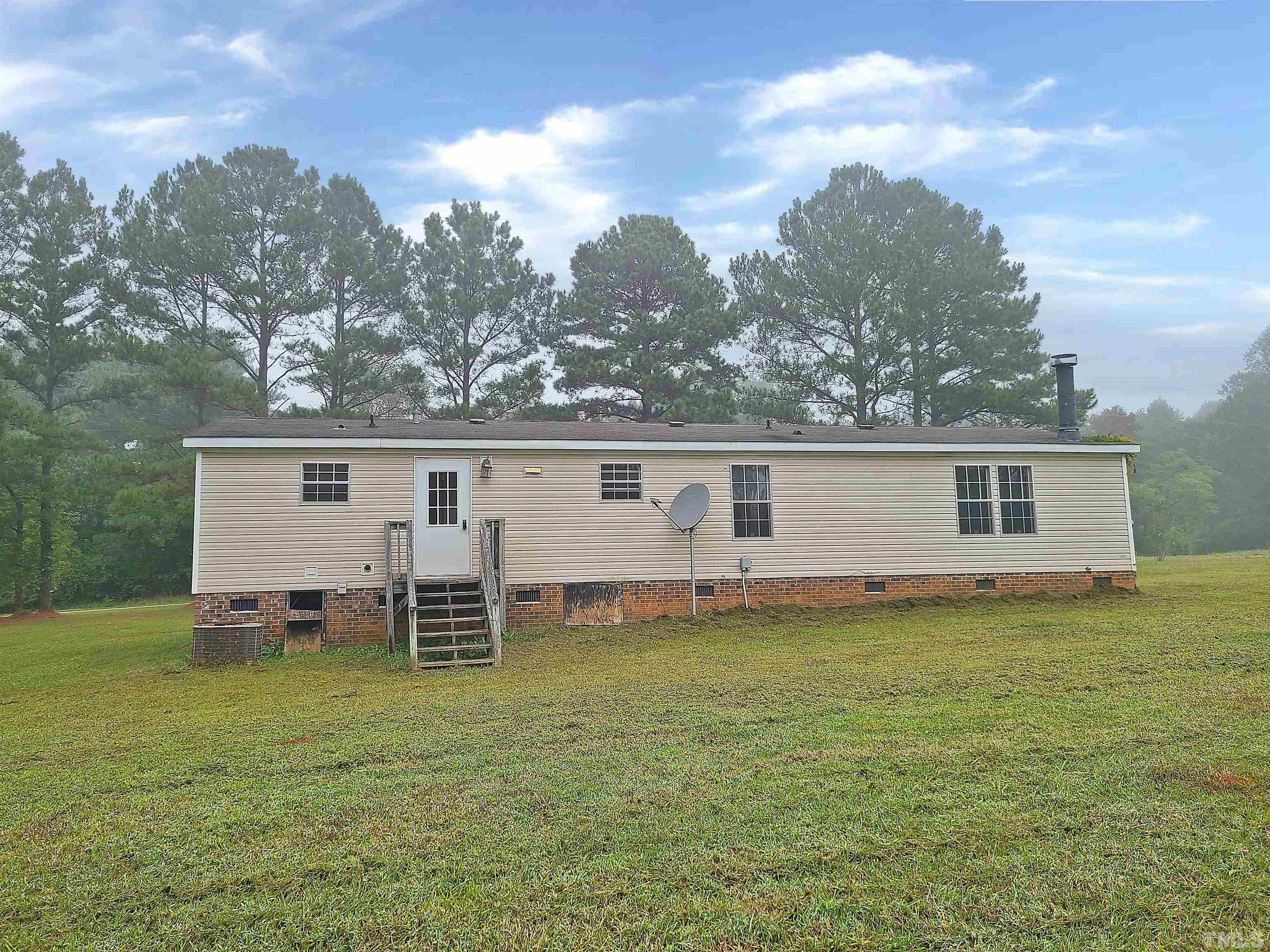 95 Moore Perkerson Road Spring Hope, NC 27882 - Photo 4 of 31 a view of a house with a yard