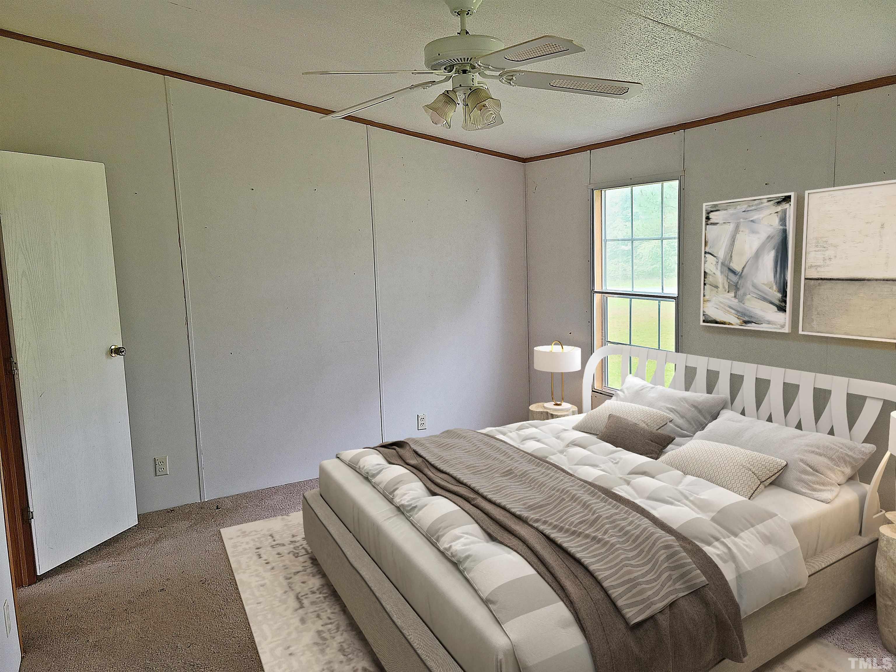 95 Moore Perkerson Road Spring Hope, NC 27882 - Photo 10 of 31 a bedroom with a bed and a window