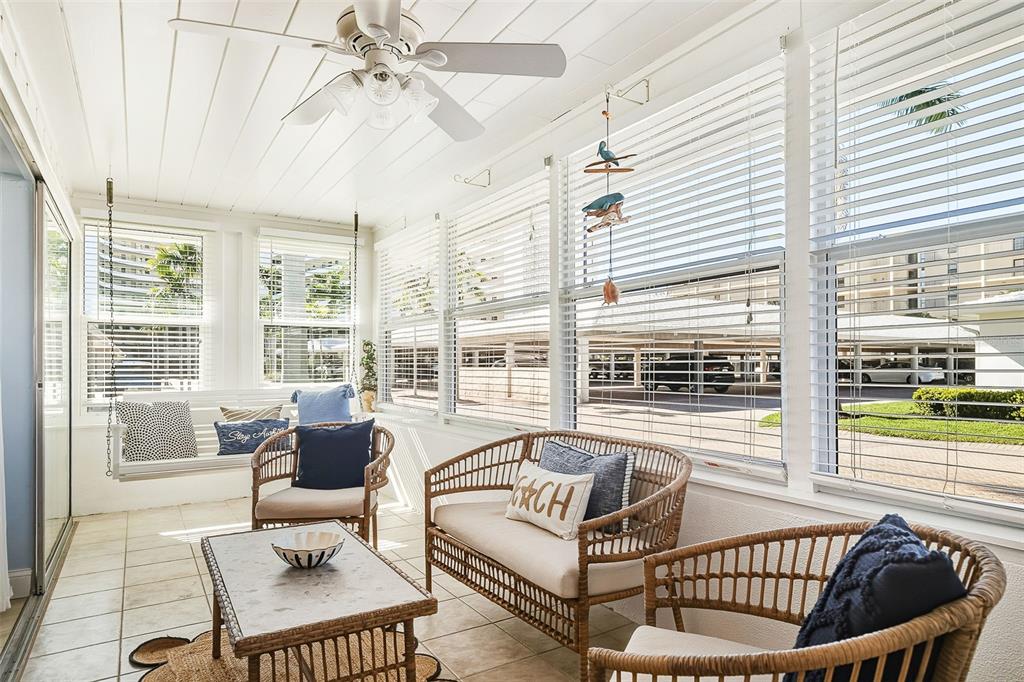 6300 Midnight Pass Road, Unit 21 Sarasota, FL 34242 - Photo 10 of 30 a living room with furniture and a large window