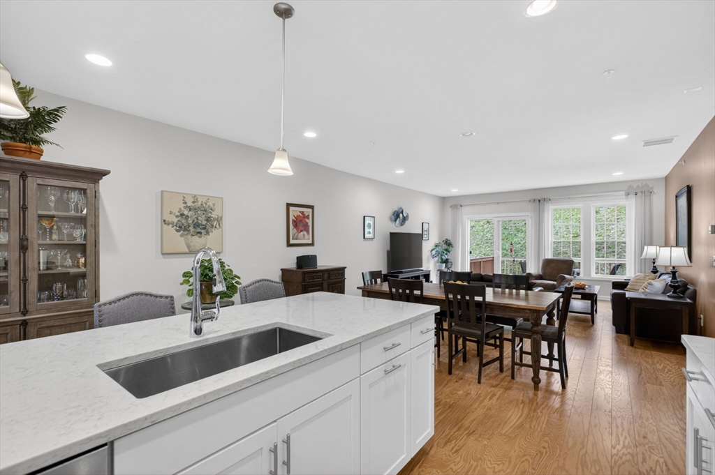 87 Shannon Way, Unit 86 Upton, MA 01568 - Photo 12 of 36 a view of a dining room with furniture window and wooden floor