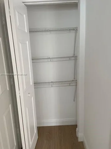 a view of an empty walk in closet