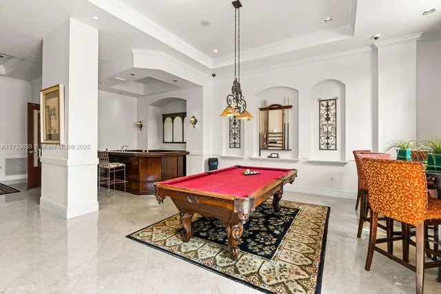 a dining hall with a dining table and chairs