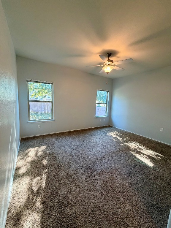 10204 Pinnacle Crest Loop Austin, TX 78747 - Photo 14 of 19 a view of a big room with windows and chandelier fan