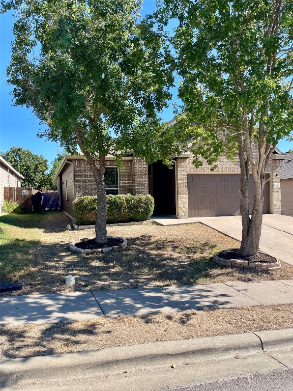 10204 Pinnacle Crest Loop Austin, TX 78747 - Photo 2 of 19 a view of a house with a yard