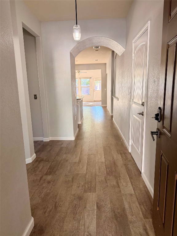 10204 Pinnacle Crest Loop Austin, TX 78747 - Photo 6 of 19 a view of a hallway with wooden floor and staircase