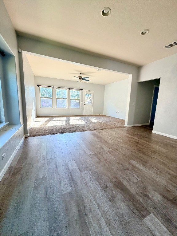 10204 Pinnacle Crest Loop Austin, TX 78747 - Photo 8 of 19 a view of an empty room with wooden floor and a window