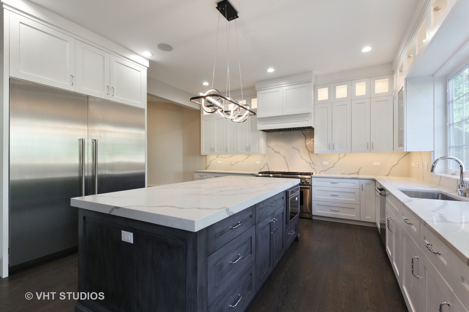 719 Juniper Road Glenview, IL 60025 - Photo 13 of 39 a kitchen with a sink refrigerator and cabinets