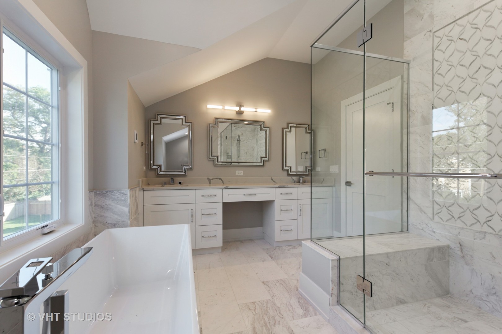 719 Juniper Road Glenview, IL 60025 - Photo 17 of 39 a en suite bathroom with a double vanity sink a mirror and a shower