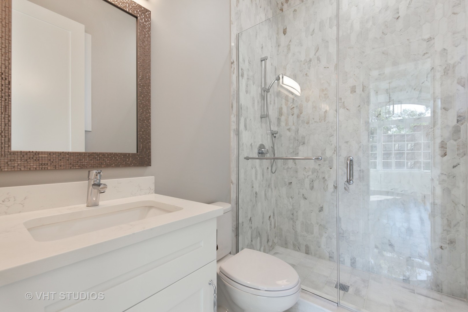 719 Juniper Road Glenview, IL 60025 - Photo 19 of 39 a bathroom with a sink toilet and shower