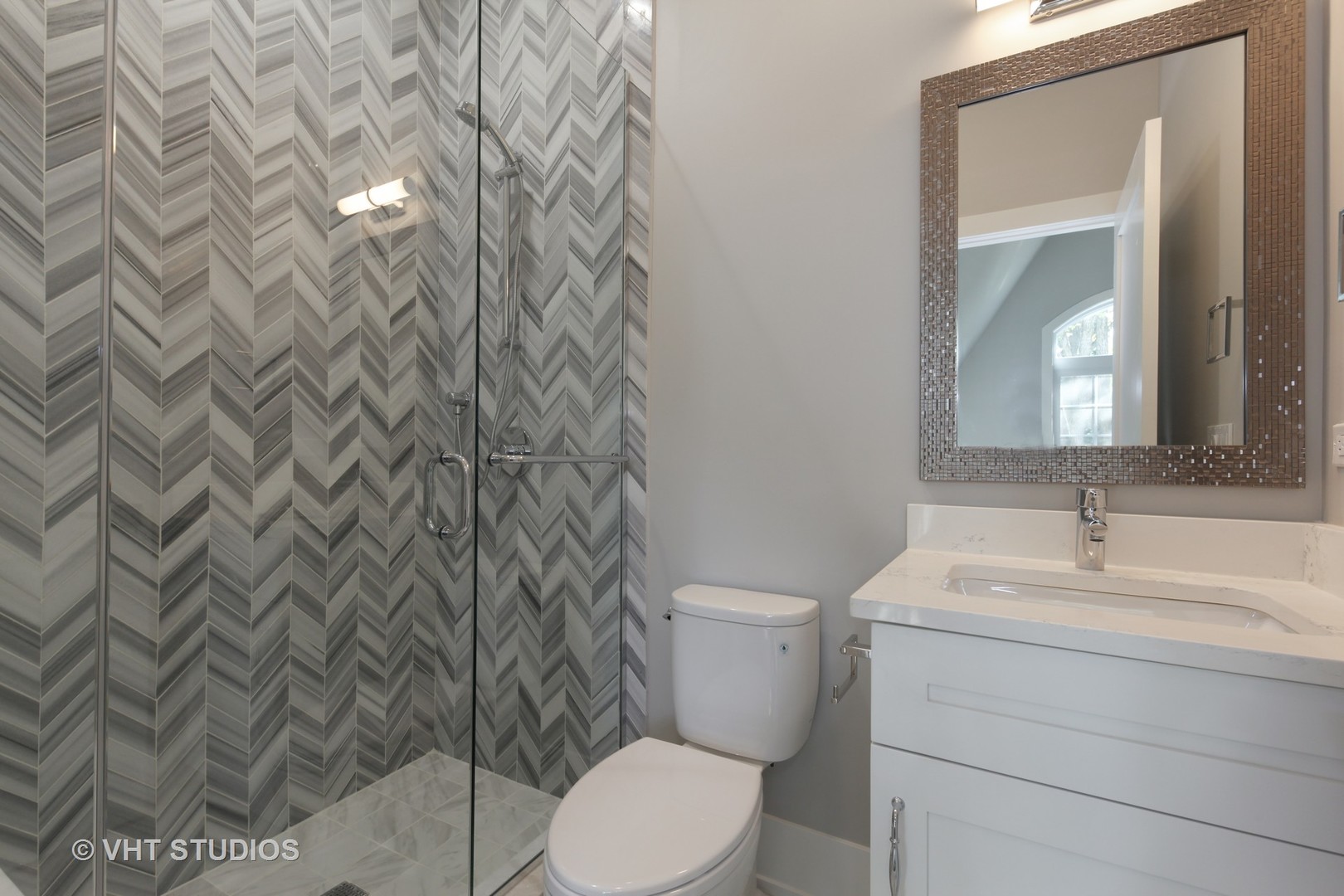 719 Juniper Road Glenview, IL 60025 - Photo 23 of 39 a bathroom with a granite countertop toilet sink and mirror