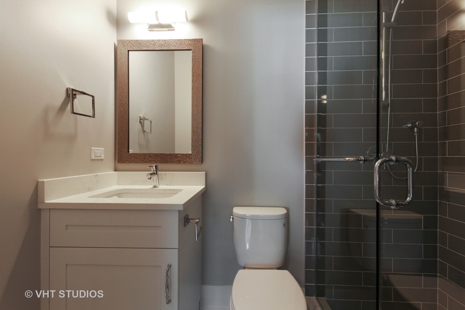 719 Juniper Road Glenview, IL 60025 - Photo 25 of 39 a bathroom with a toilet sink shower and mirror
