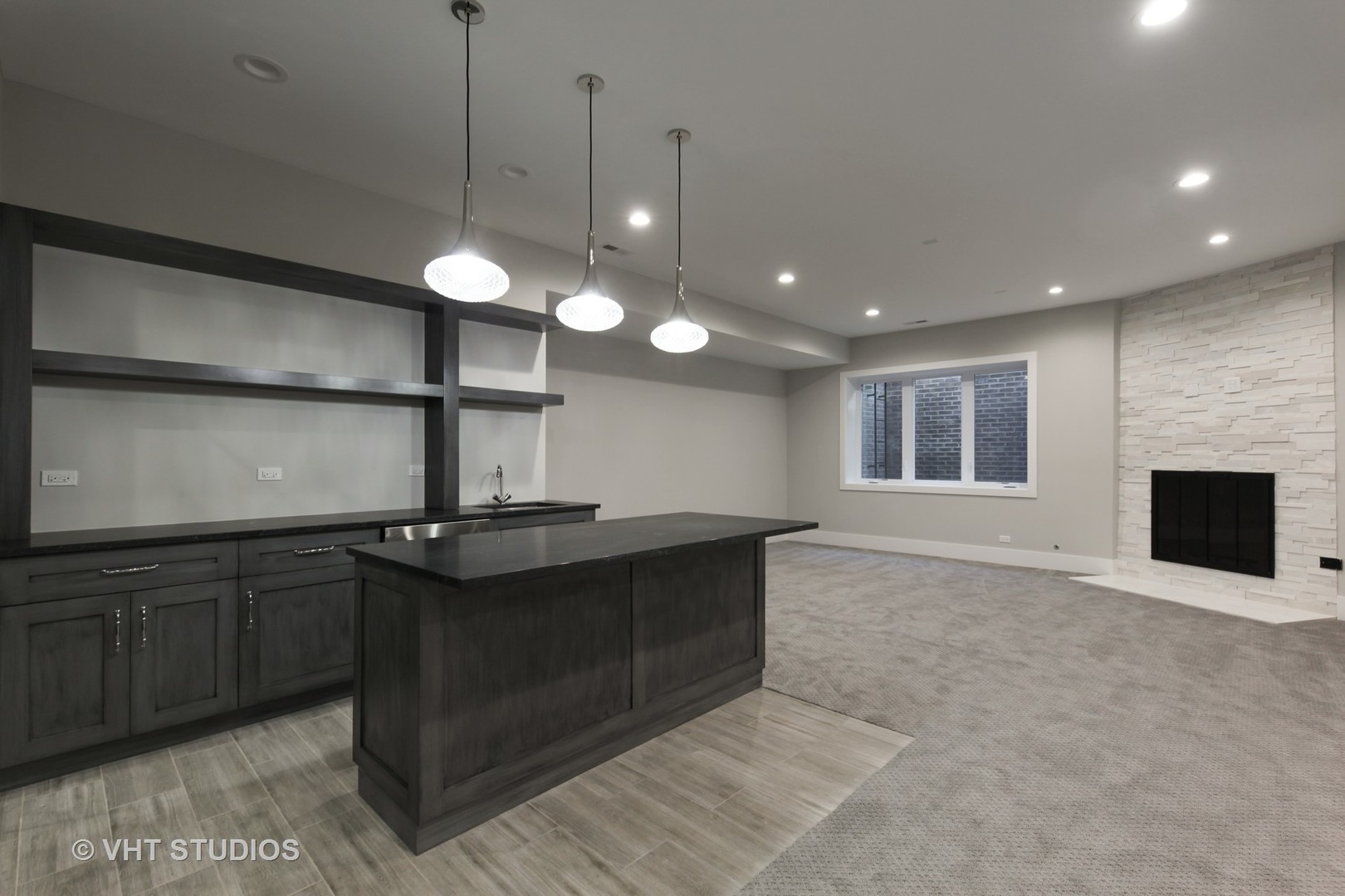 719 Juniper Road Glenview, IL 60025 - Photo 28 of 39 a kitchen with kitchen island a sink stainless steel appliances and a chandelier