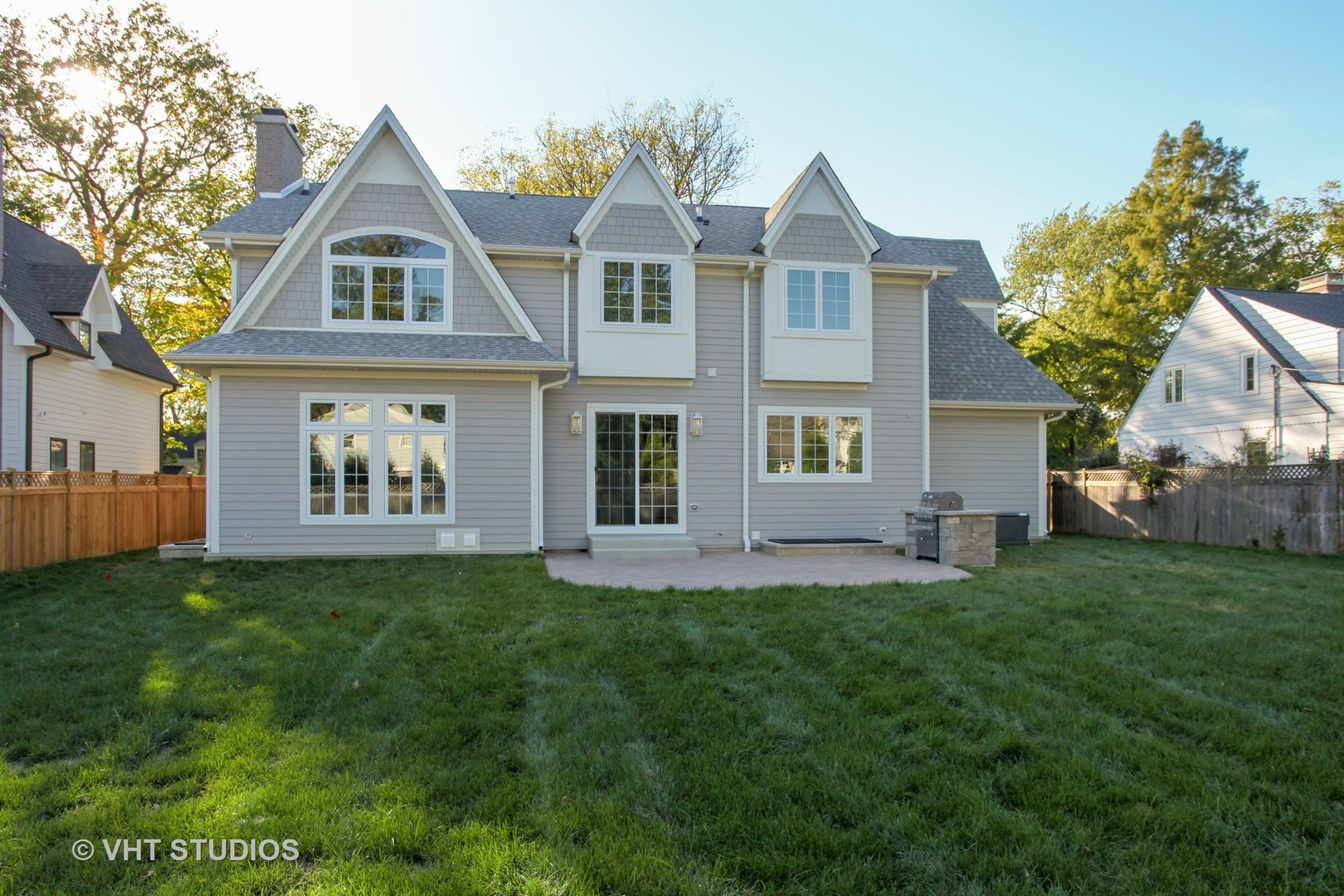 719 Juniper Road Glenview, IL 60025 - Photo 36 of 39 a front view of a house with a garden and trees