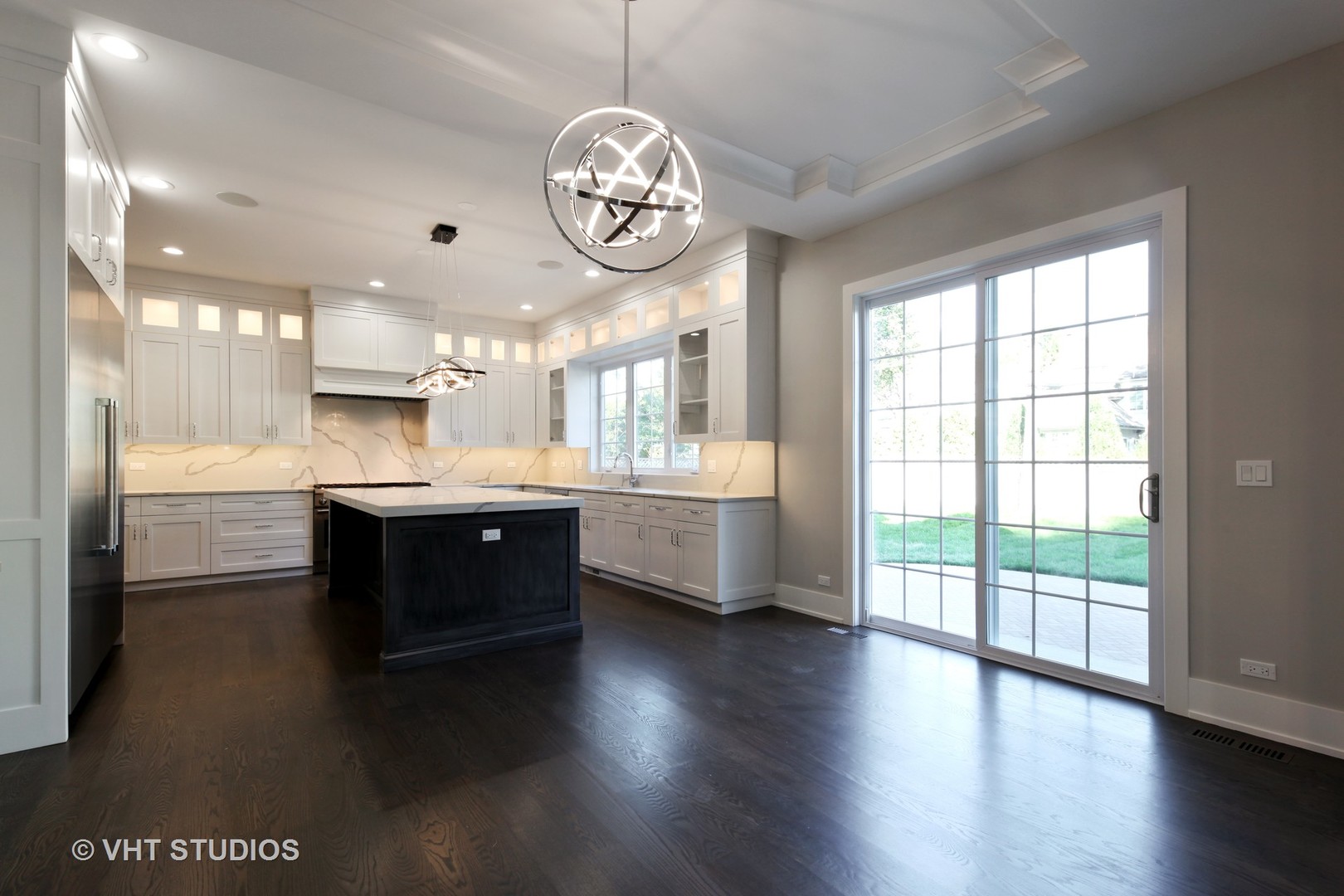 719 Juniper Road Glenview, IL 60025 - Photo 9 of 39 a large white kitchen with a large window and stainless steel appliances