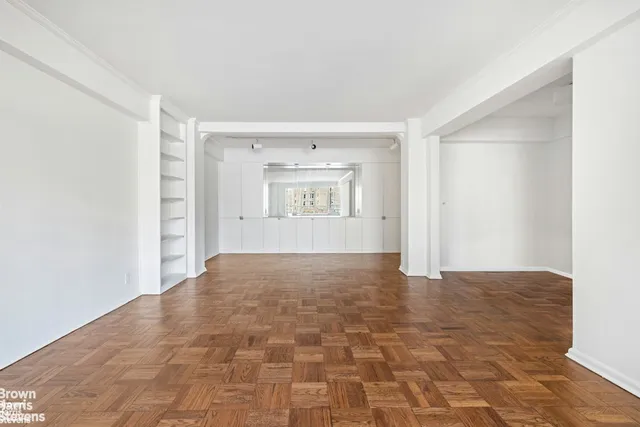 a view of an empty room with a window