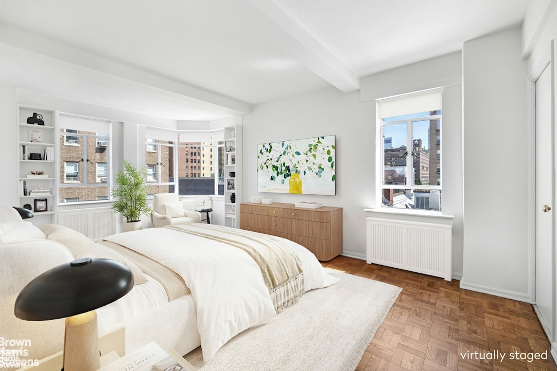 20 East 74th Street, Unit 8A Manhattan, NY 10021 - Photo 4 of 22 a bedroom with a bed and window