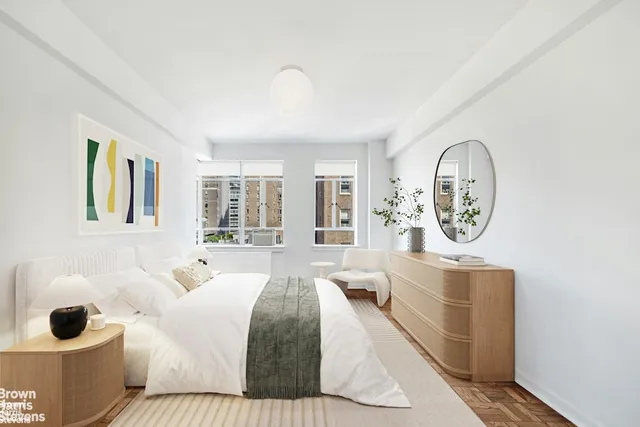 a bedroom with a bed and window