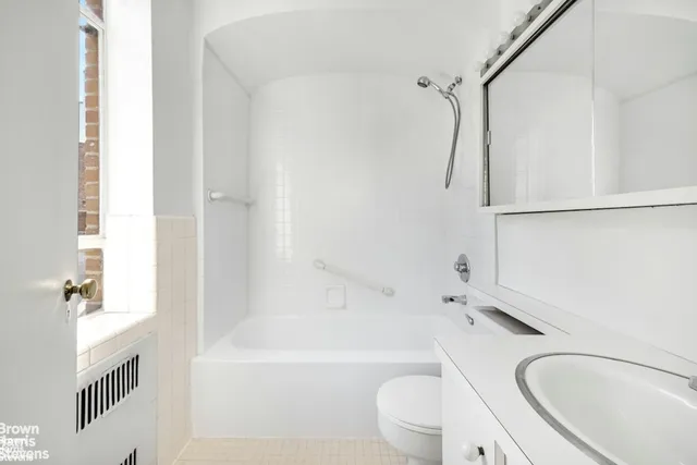 a kitchen with stainless steel appliances granite countertop a sink and wooden cabinets